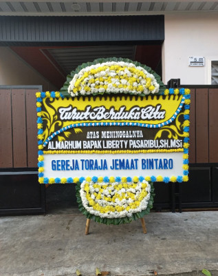 Papan Bunga Duka di Siding